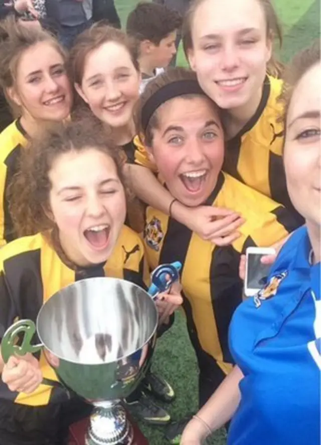 'Cambridge Utd' pose for a selfie with the 2015 under-16 females trophy from the FA People's Cup