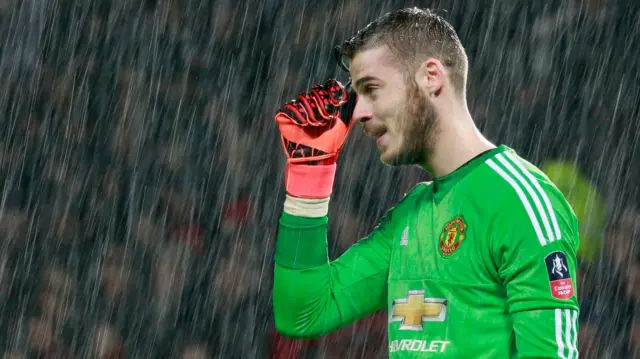 David De Gea looks on in the rain