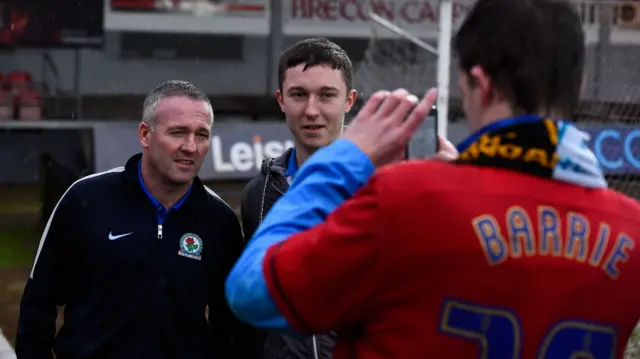 Paul Lambert poses for a picture with a fan