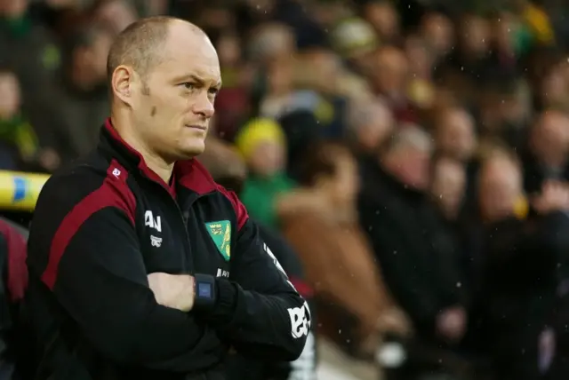 Alex Neil looks on