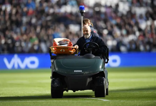 Player is stretchered away