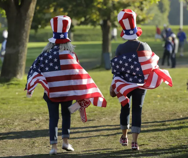 Two American fans with flags