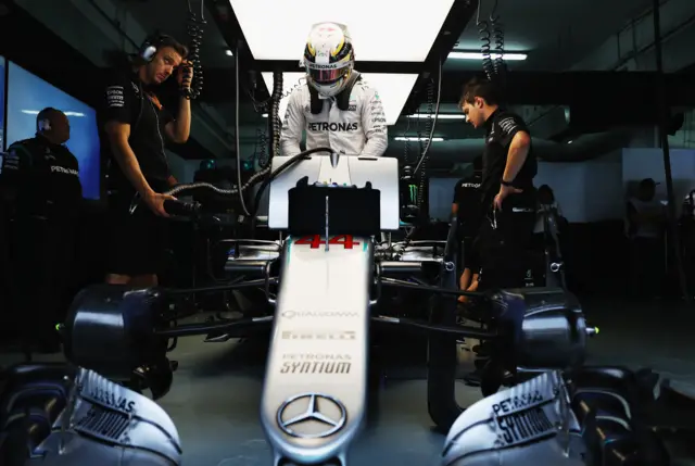 Lewis Hamilton steps out of his car