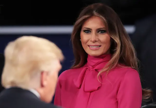 Melania Trump greets her husband after the debate