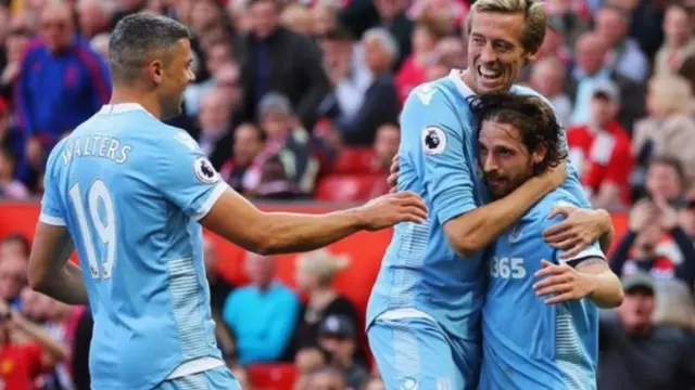 Joe Allen celebrating with Stoke players after scoring