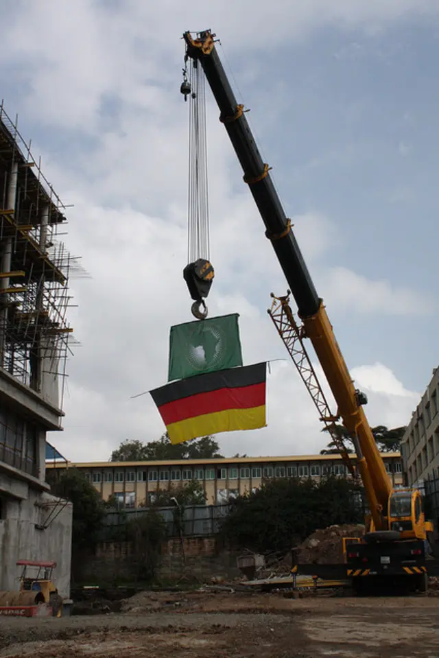 Crane with AU and German flags