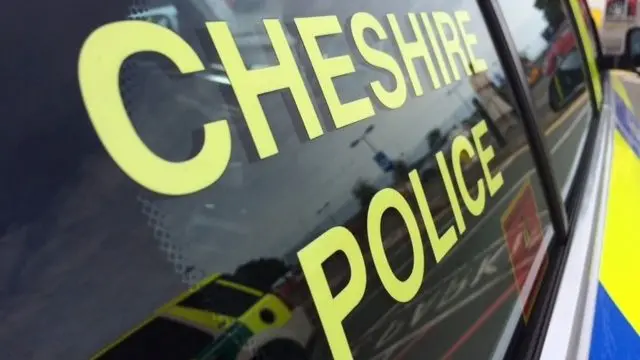 Cheshire Police logo on side of car