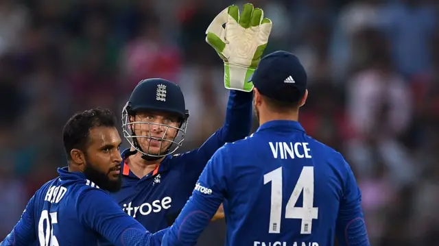 Jos Buttler celebrates with James Vince and Adil Rashid