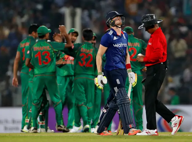 Sam Billings walks off after being caught