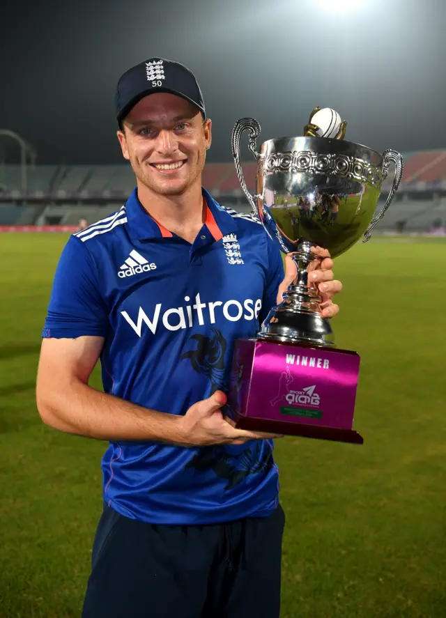 Jos Buttler holds the series trophy