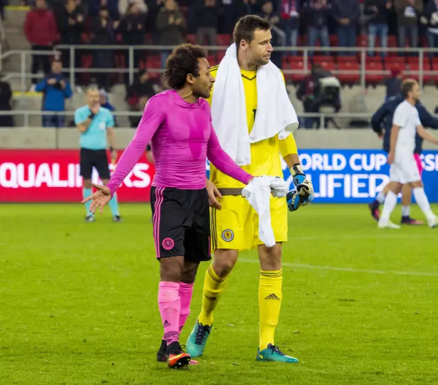 Ikechi Anya (left) and Scotland goalkeeper David Marshall