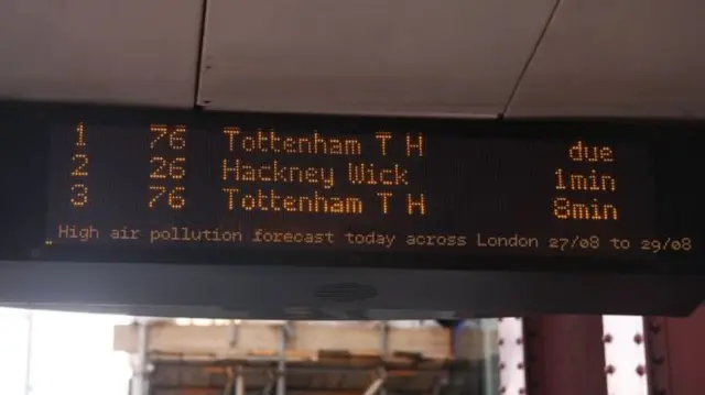 air pollution alert at a bus stop