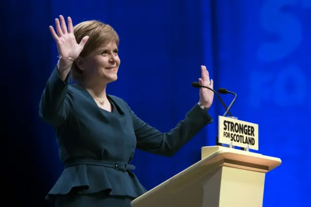 Nicola Sturgeon enjoys the applause on stage at the SECC in Glasgow during the SNP conference