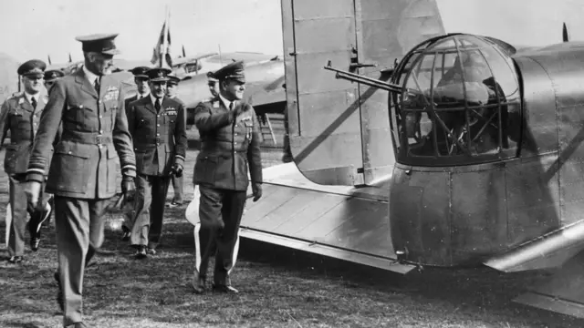 General Milch (right) and Air Chief Marshal Sir Edgar Ludlow-Hewitt were photographed taking a group of German Air Force officers on an inspection tour of their aircraft at RAF Mildenhall