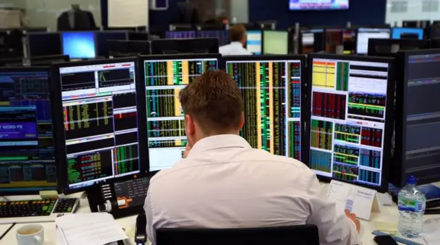 Share trader at desk