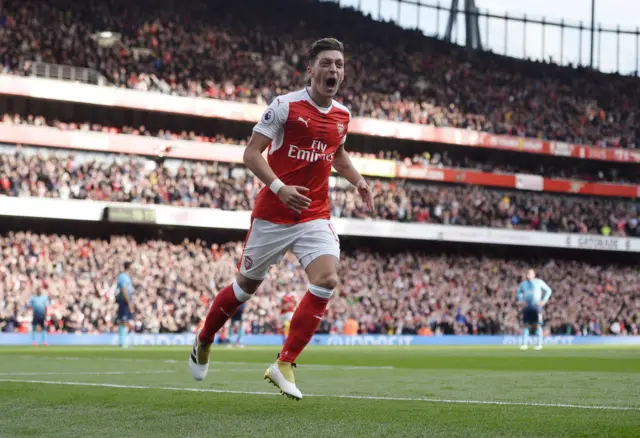 Mesut Ozil celebrates