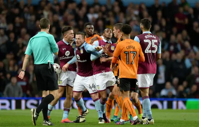 Aston Villa and Wolves players clash