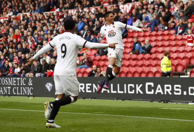 Troy Deeney celebrates with Jose Holebas