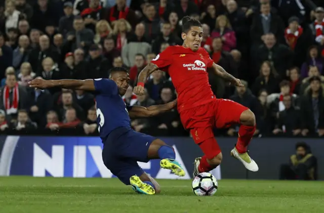 Antonio Valencia tackles Roberto Firmino