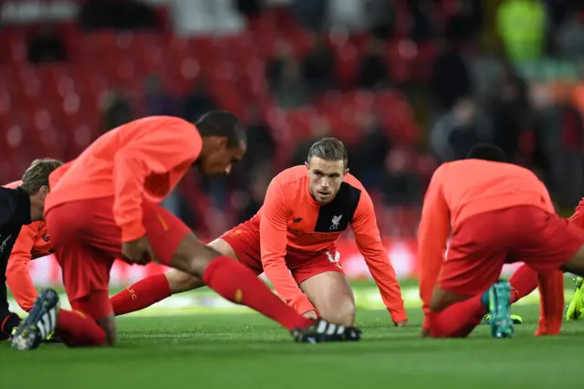 Liverpool captain Jordan Henderson warms-up