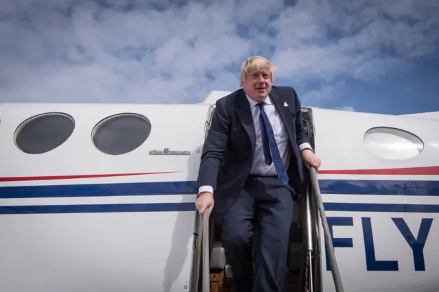 Boris Johnson leaving a plane