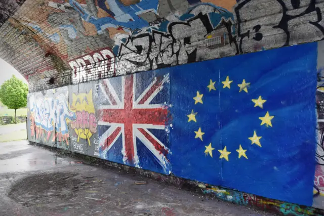 Eu and UK flags painted on a wall