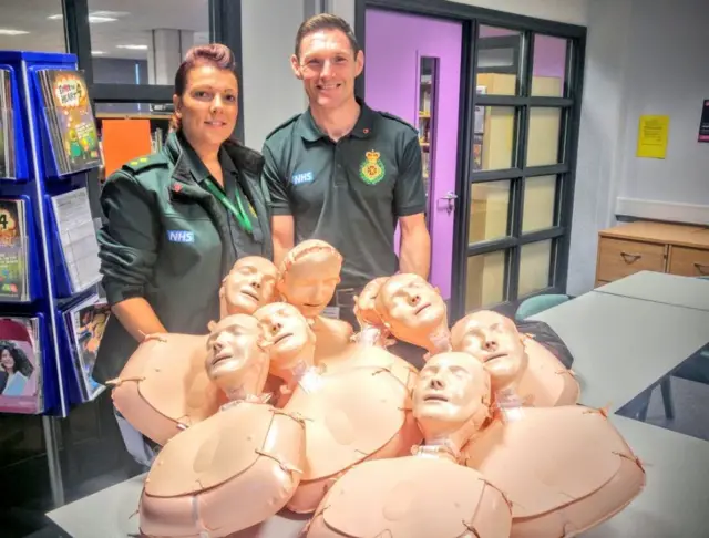 Two paramedics with CPR dummies