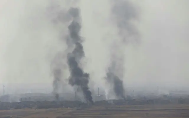 Smoke rises from clashes at Bartila in the east of Mosul during clashes with Islamic State militants