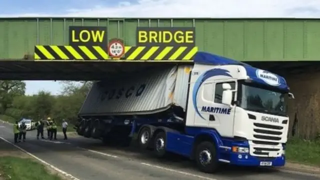 This railway bridge crash disrupted both train passengers' and motorists' journeys