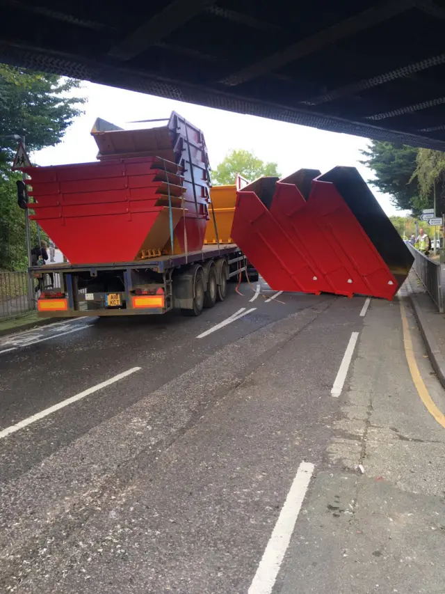 Skips under a bridge