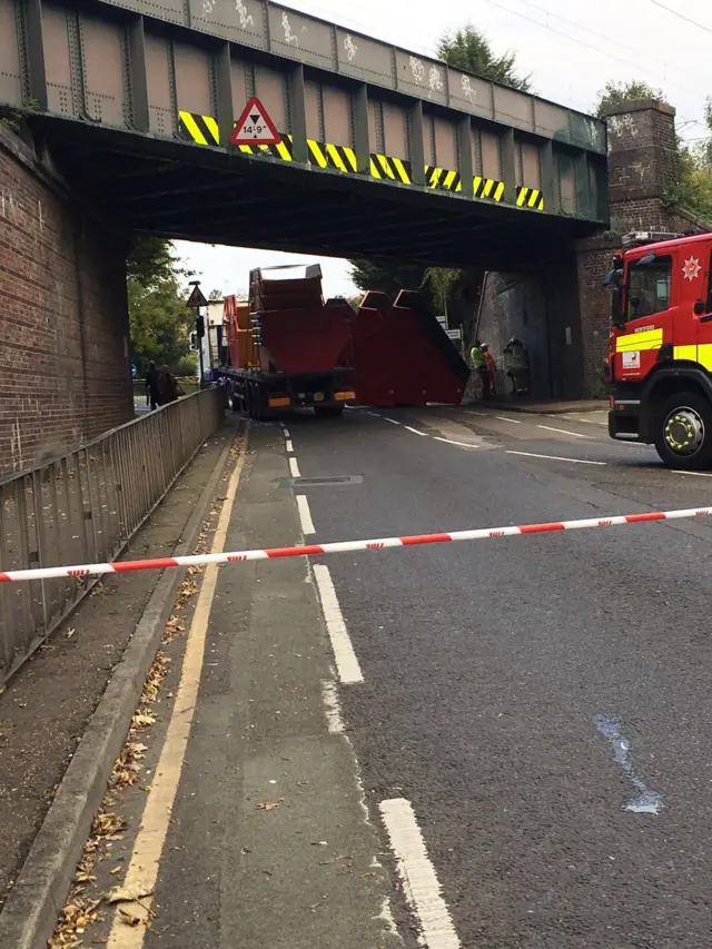 Skips under a bridge