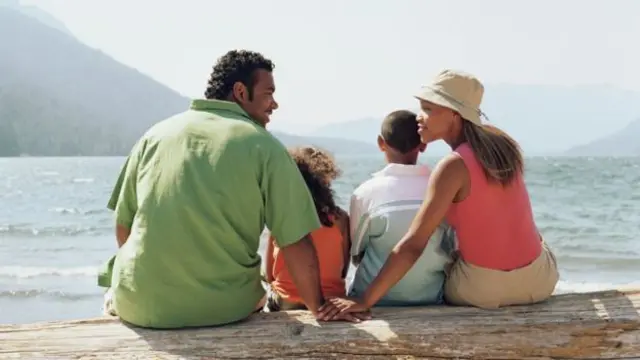 A family sat by the sea