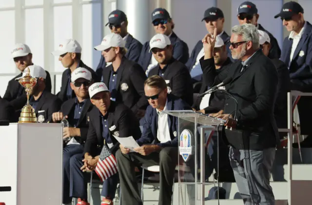 Players at the Ryder cup in hats and blazrers