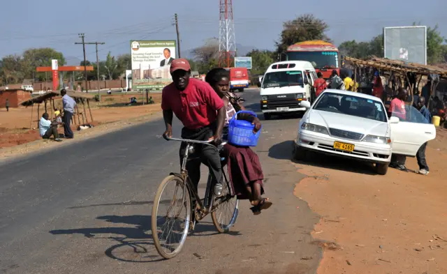 People on a bicycle in Malawi