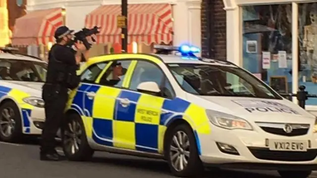 Armed police take aim