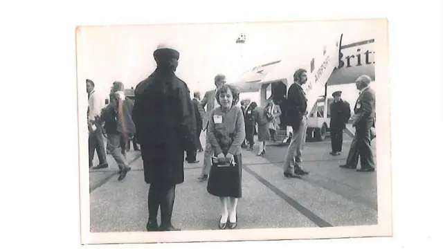 Picture of Karen Pedley in front of Concorde from file found at her home
