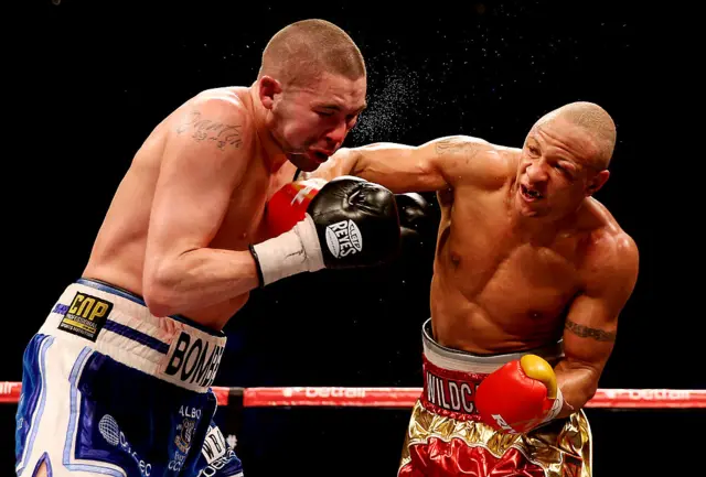 Tony Bellew of England (L) is caught by Isaac Chilemba of Malawi