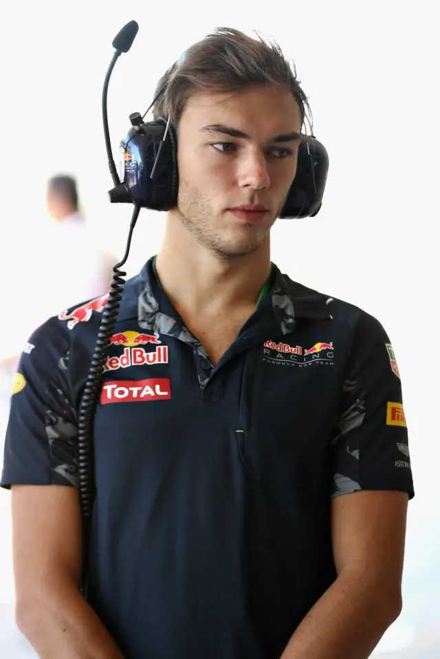 Pierre Gasly of France and Red Bull Racing watches on in the garage during practice