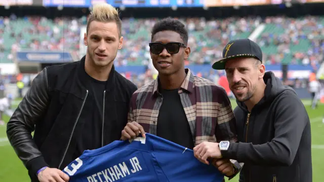 Stoke's Marko Arnautovic and Bayern Munich pair David Alaba and Franck Ribery are watching the NFL game.