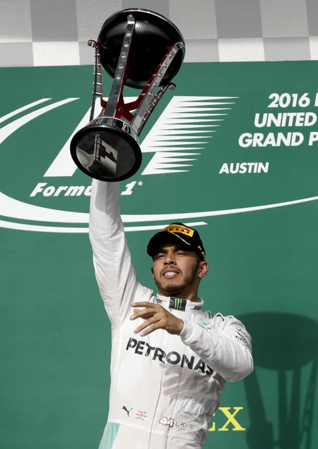 Hamilton lifts the trophy