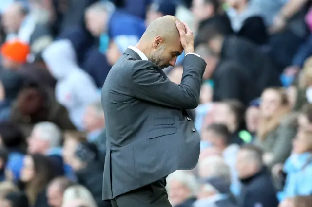 Pep Guardiola looks dejected