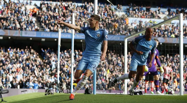 John Stones celebrates after he thinks he scores