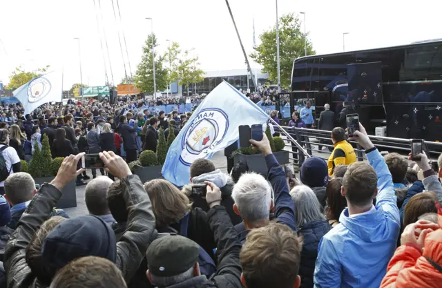 Manchester City players arrive at the ground