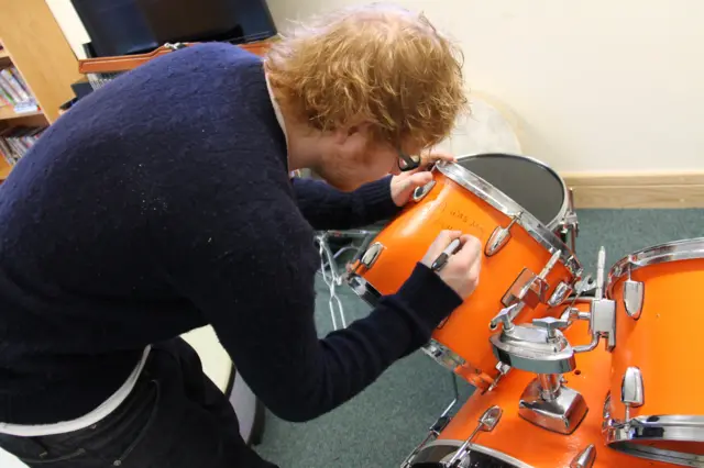 Ed signing the drums