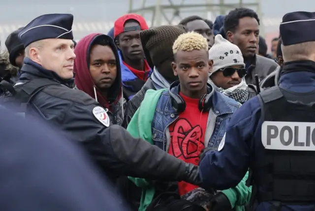 Migrants queuing in Calais