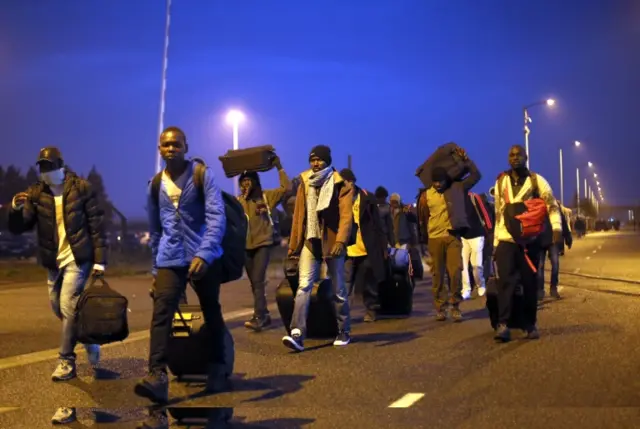 Migrants leaving the 'Jungle' camp in Calais