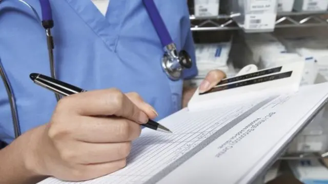 Nurse making notes