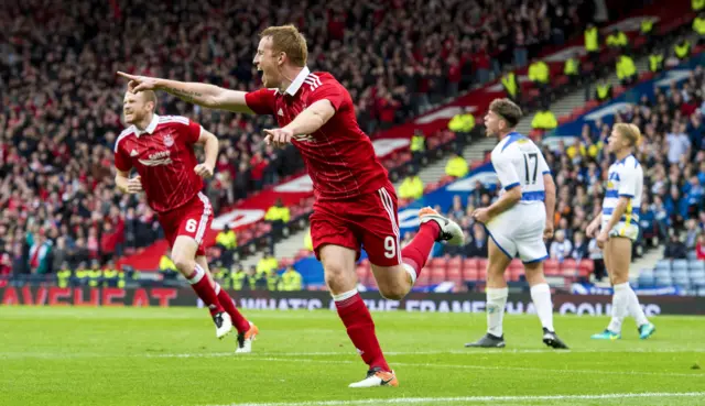 Adam Rooney celebrates scoring for Aberdeen against Morton