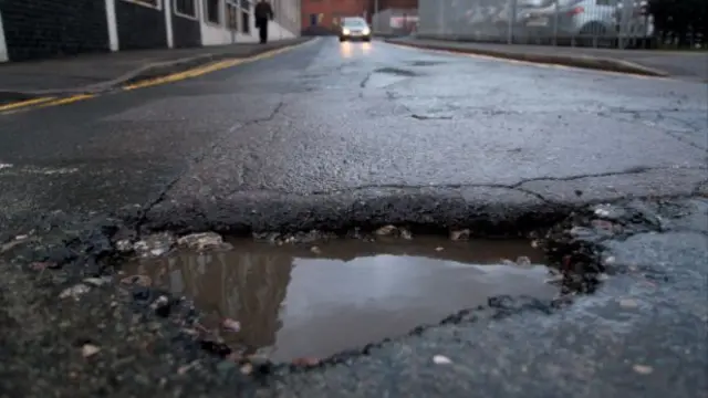 Pothole in road