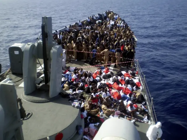 A handout picture provided by the Spanish Army Mayor Staff (AJEMA) showing the rescue of around 703 immigrants by the fragate "Navarr" close to the Libyan coast, 25 October 2016.